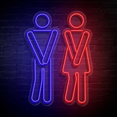 Sinais de néon azul e vermelho representando figuras humanas em cima de parede de tijolos.