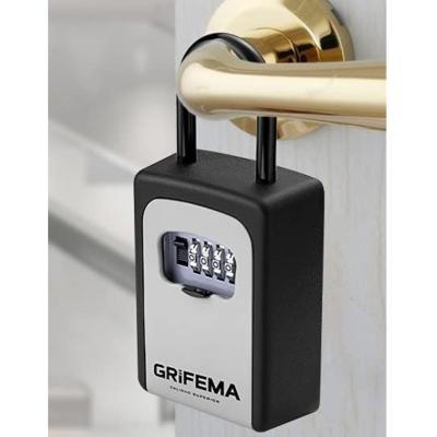 Caixa de segurança preta e cinza pendurada numa maçaneta dourada