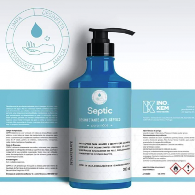 Frasco azul de desinfetante para mãos com doseador e rótulo