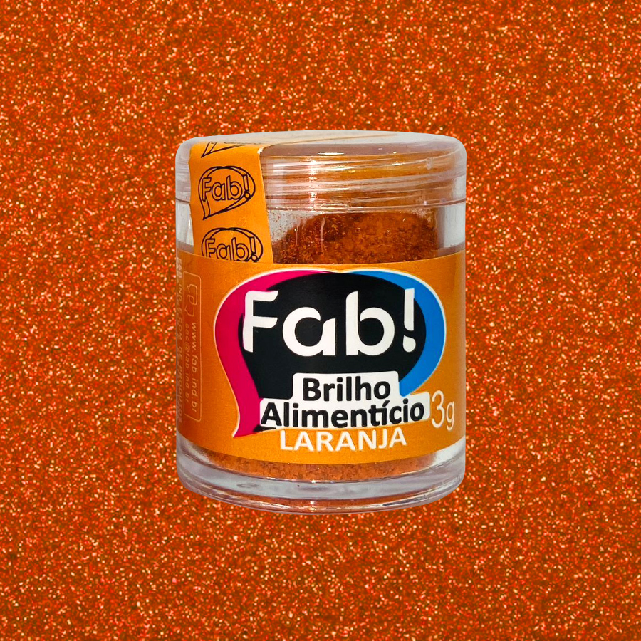 Brilho Alimentício Laranja Frasco de brilho alimentício laranja da marca Fab com 3g em fundo brilhante laranja.