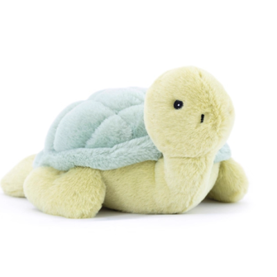 Pelúcia tartaruga amarela e azul sobre fundo branco
