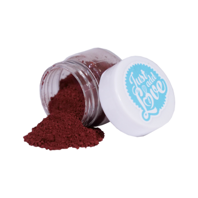 Frasco de plástico com pó vermelho e tampa branca com texto azul