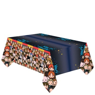 Toalha de mesa azul escuro com estrelas e bordas com múltiplas caras de cartoon coloridas