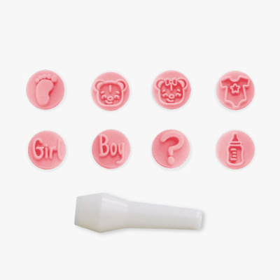 Conjunto de carimbos rosa redondos com vários desenhos e uma peça branca de plástico.