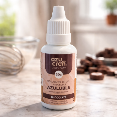 Frasco de corante em gel lipossolúvel para chocolate sobre superfície de mármore