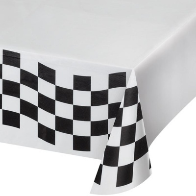 Toalha de mesa branca com padrão xadrez preto e branco numa extremidade