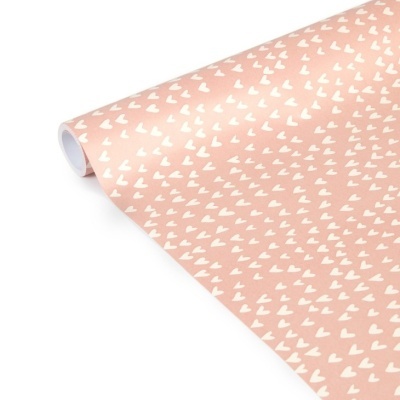 Rolo de papel de embrulho cor-de-rosa com corações brancos