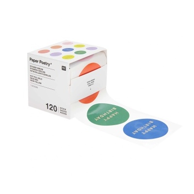 Rolo de autocolantes redondos coloridos em caixa branca com texto Paper Poetry