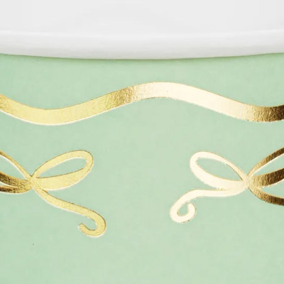 Papel decorativo verde com detalhes dourados brilhantes