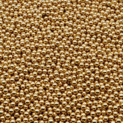 Pequenas esferas metálicas douradas, lisas e brilhantes
