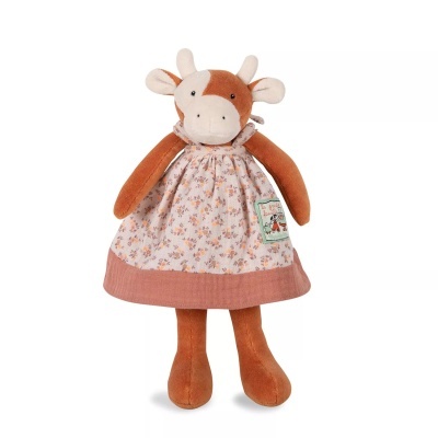 Pelúcia de vaca com vestido floral e etiqueta com texto e ilustração