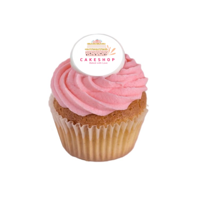 Cupcake com cobertura rosa e topper branco com texto CAKESHOP