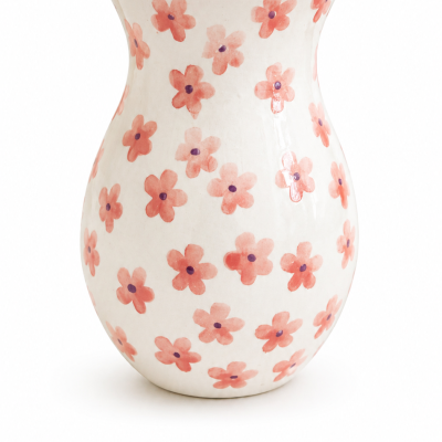 Vaso cerâmico branco com padrão de flores cor-de-rosa e centro roxo