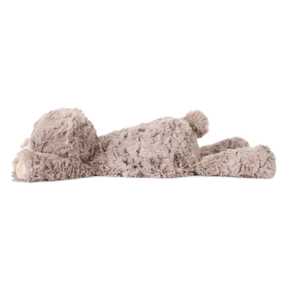 Pelúcia de cão marrom claro deitada