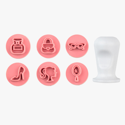 Conjunto de carimbos decorativos em plástico rosa com suporte branco
