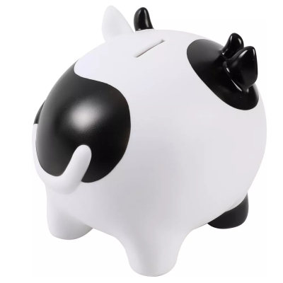 Mealheiro na forma de vaca branca com manchas pretas