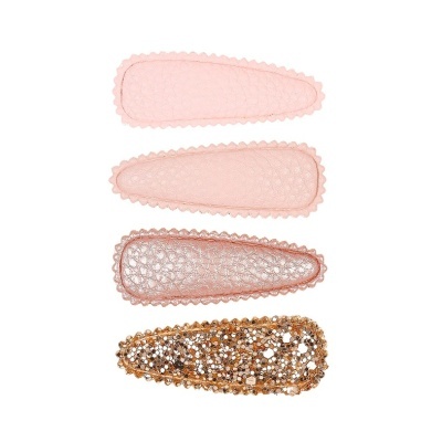 Quatro molas de cabelo rosas e douradas com diferentes texturas e brilho