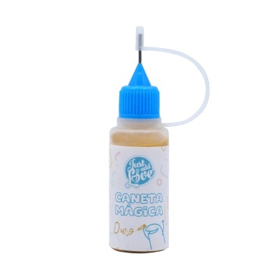 Frasco plástico translúcido com tampa azul e conta-gotas com rótulo 'CANETA MÁGICA Ouro'