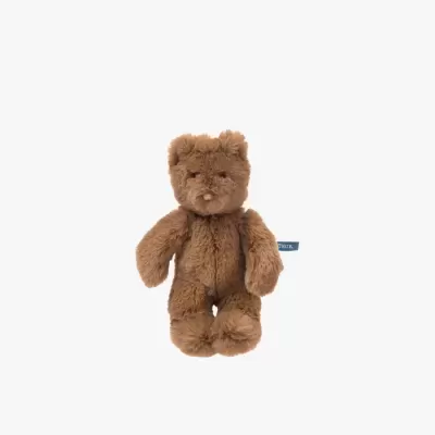 Urso de pelúcia castanho com etiqueta azul