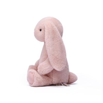 Ursinho de peluche cor-de-rosa claro em forma de coelho sentado