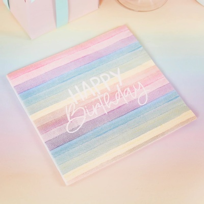 Guardanapo de papel riscado em tons pastel com texto 'HAPPY Birthday'