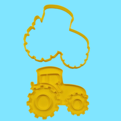 Cortadores de biscoito amarelos em forma de trator sobre fundo azul