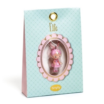 Embalagem azul clara com figura de elfo rosa visível numa janela oval