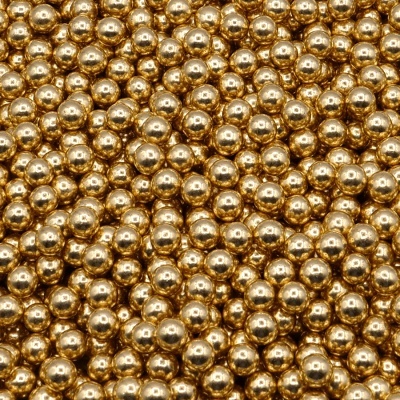 Muitas pequenas esferas metálicas douradas com superfície brilhante
