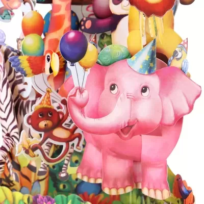 Figura recortada de elefante cor-de-rosa com balões e chapéu festivo