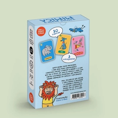 Caixa azul de jogo de cartas ilustradas com desenhos de elefante, cão e criança, texto em português e ilustração de leão