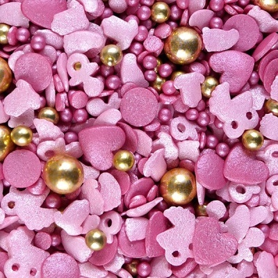 Confeitos para bolos em rosa e dourado com formas variadas e textura brilhante