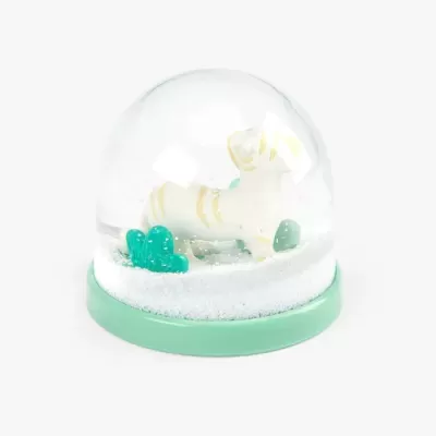 Globo de neve com cão branco riscado amarelo e cactos verdes