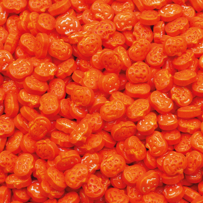 Doces de abóbora laranja com rosto decorado