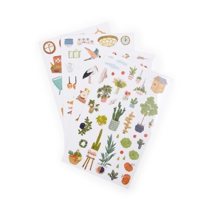 Folhas de autocolantes com desenhos coloridos de plantas, frutas, aves e objetos domésticos.