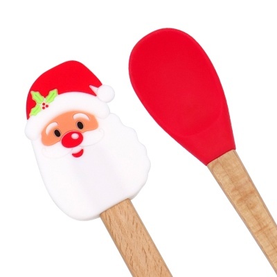 Utensílios de cozinha com pá vermelha e espátula decorativa de Pai Natal com cabo de madeira.