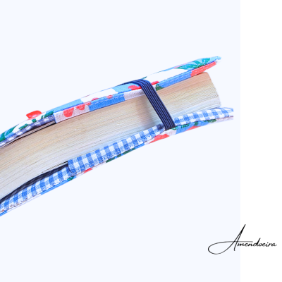 Capa protetora de livro colorida com padrão floral e elástico preto