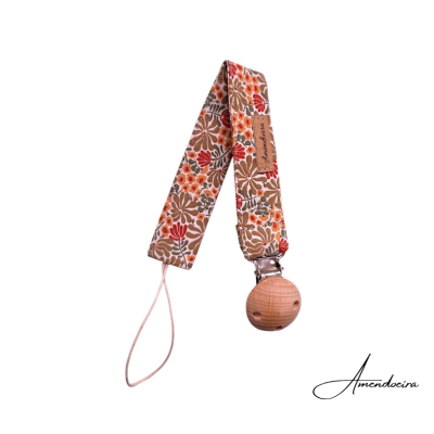 Prendedor para chucha com padrão floral e peça de madeira