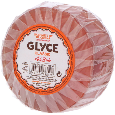 Sabonete redondo de glicerina com rótulo branco e laranja