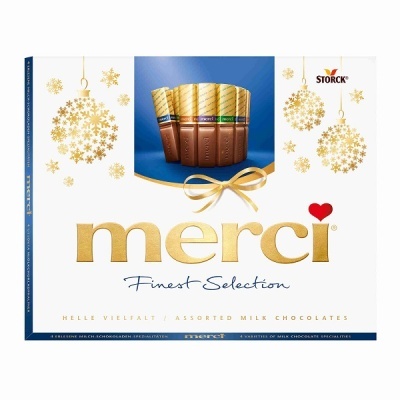 Embalagem de chocolates merci Finest Selection com decoração dourada e branca
