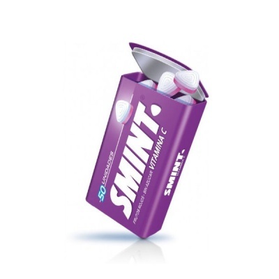 Embalagem roxa aberta de pastilhas SMINT Vitamina C com três pastilhas brancas visíveis