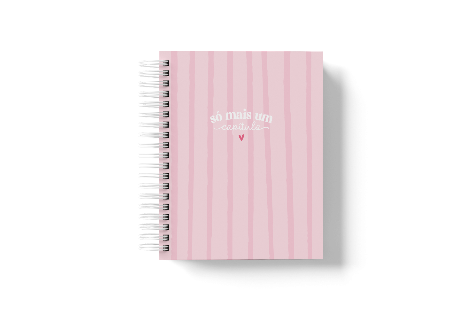 Caderno cor-de-rosa com espiral branca e texto branco no centro.