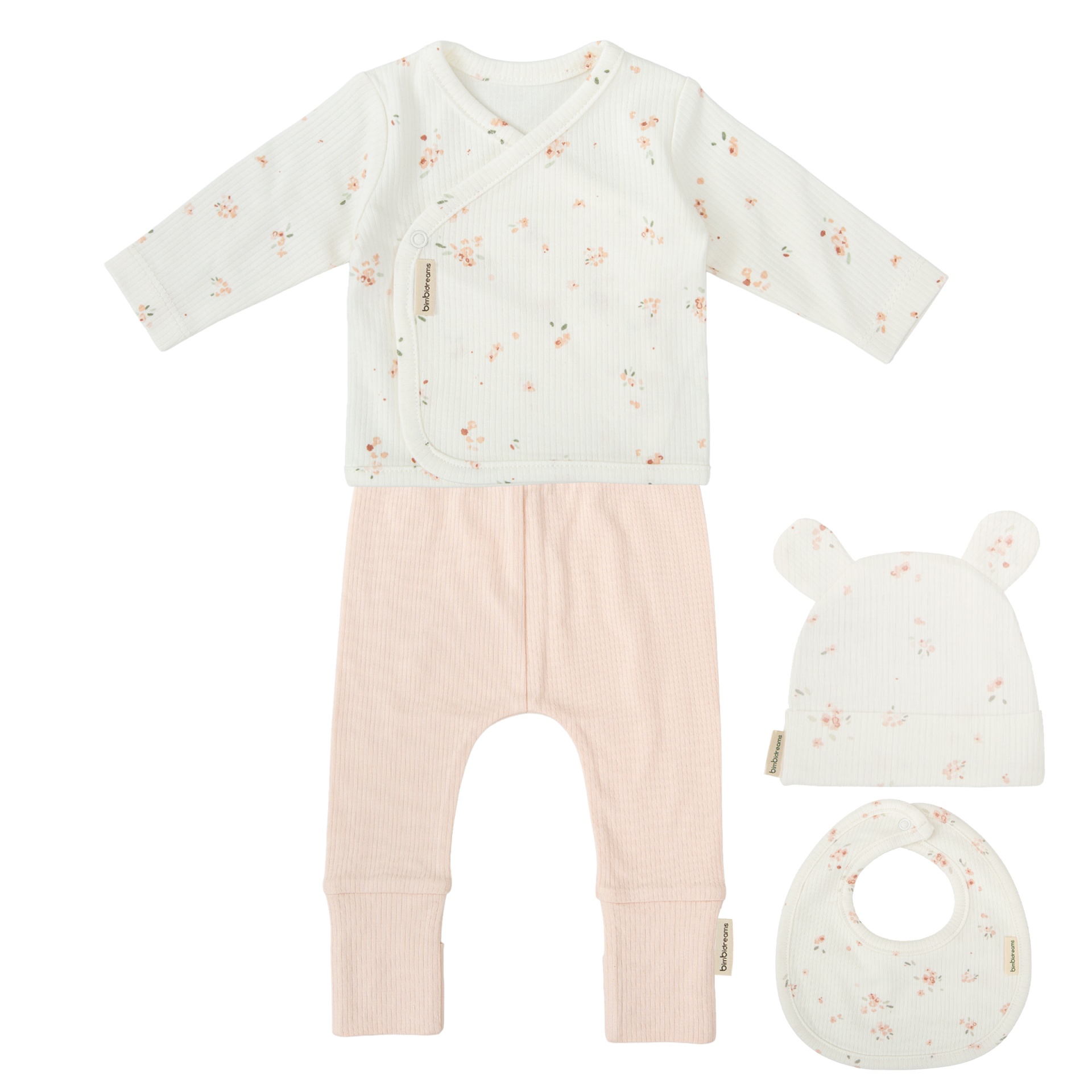 Conjunto de roupa de bebé com camisola, calças, gorro e babete em branco e rosa com estampa floral.