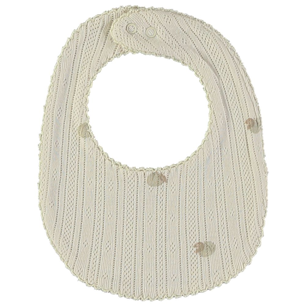 Babete de bebé creme de malha com riscas e motivos decorativos