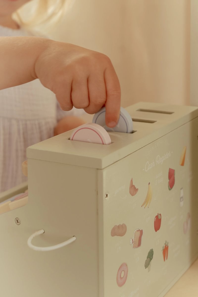 Registadora de caixa de brincar colorida com discos coloridos e desenhos de alimentos