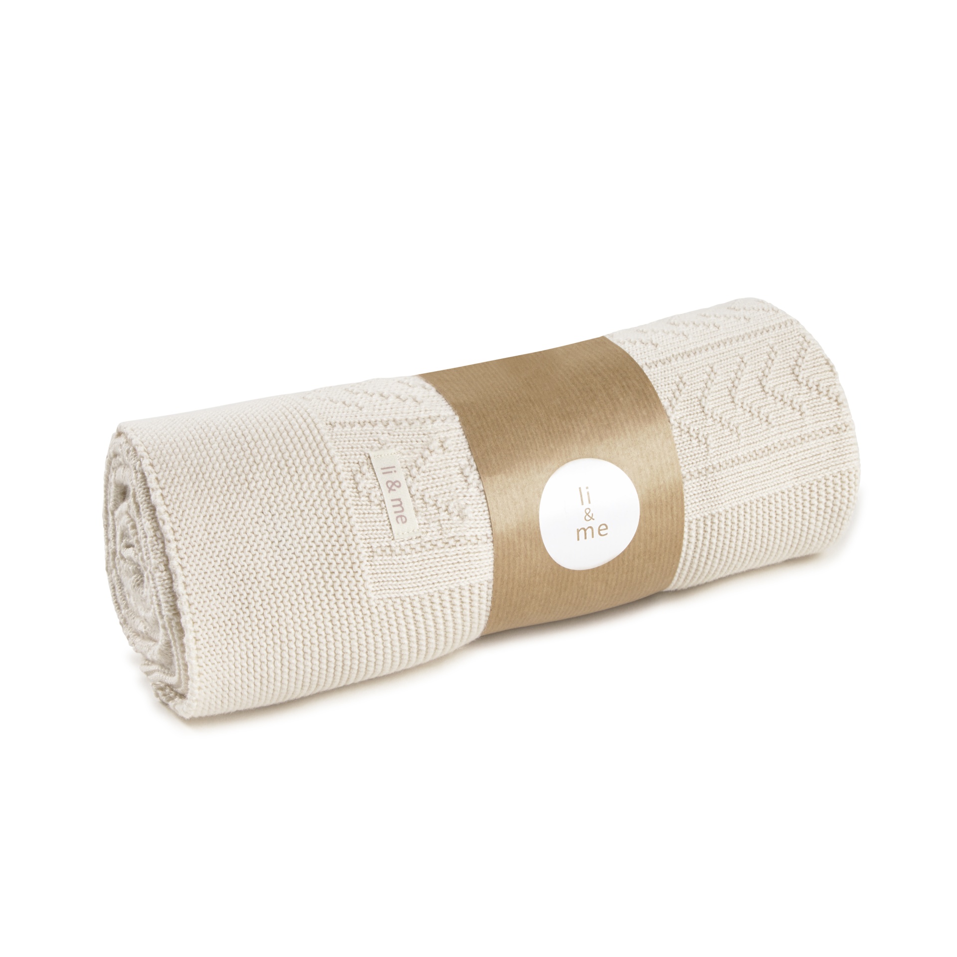 Manta de malha branca enrolada com etiqueta li & me e fita de papel castanha