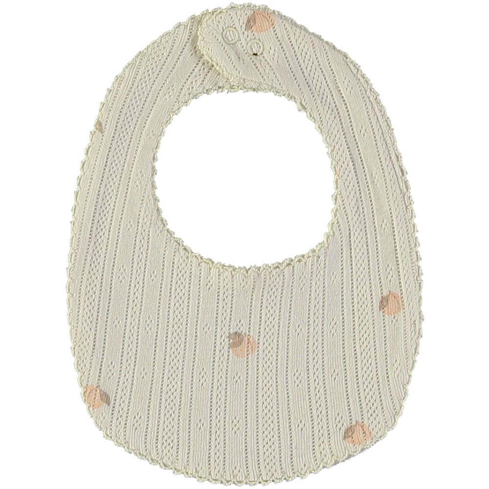 babete creme com riscas verticais e círculos cor de rosa