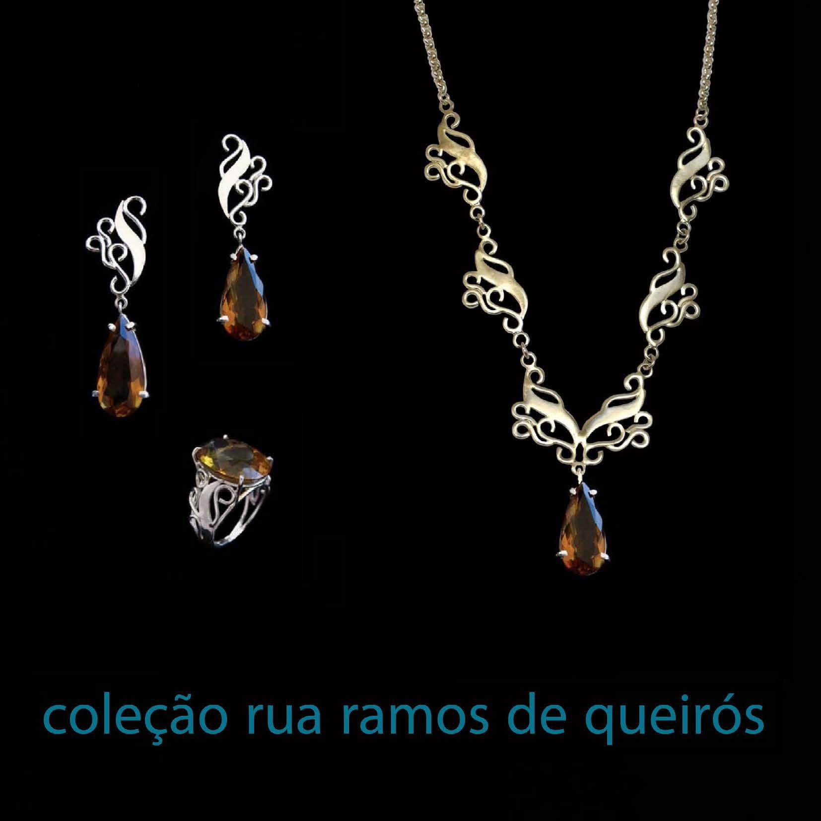 Anel Ramos de Queiróz Conjunto de joias prateadas com pedras castanhas e texto da coleção