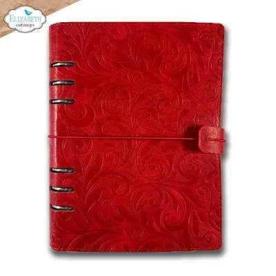 Caderno vermelho com padrão em relevo e fecho de elástico