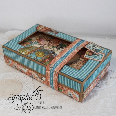 Caixa decorativa retangular com tampa de acetato e desenho vintage em azul e castanho