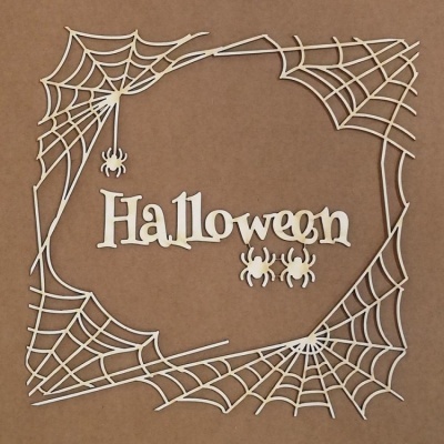 Decoração branca de Halloween com aranhas e teias de aranha em fundo castanho